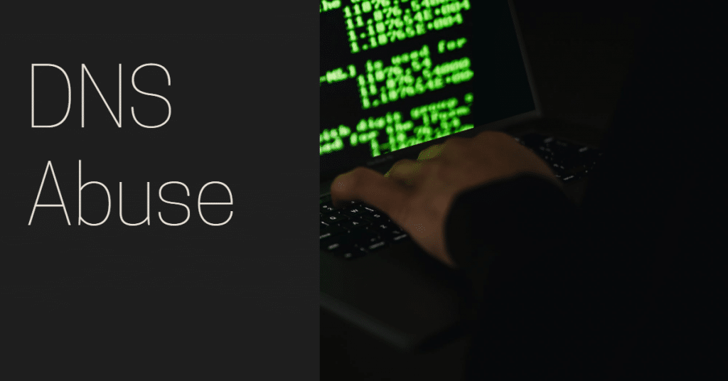 Image of hand hovering over keyboard with a screen with green characters and the words "DNS abuse"