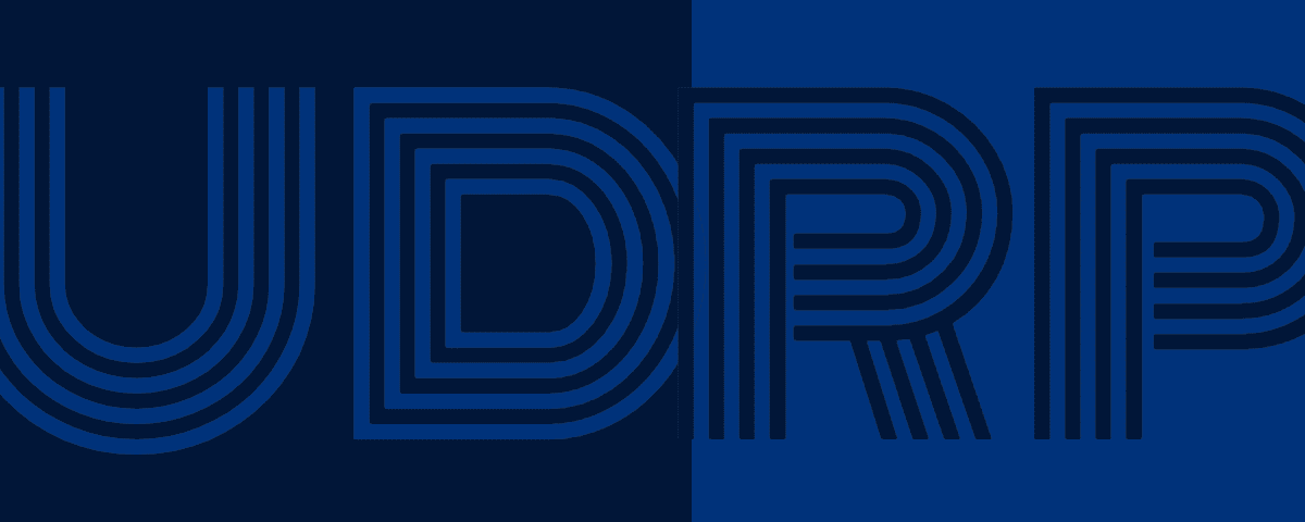 The initialism UDRP for "uniform domain name dispute resolution policy" in black and blue on a black and blue background