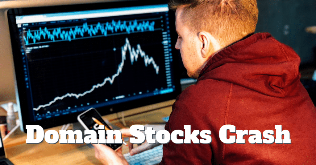 Picture of man in front of computer showing falling stock prices