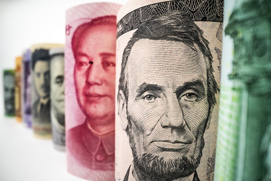 Picture of rolls of currency, with a focus on Abe Lincoln and the US dollar