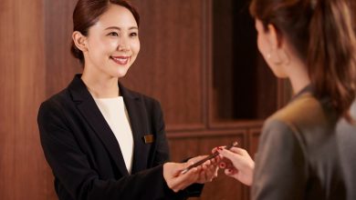 Hotel-Receptionist-Assisting-a-Guest-nQee3J.jpg